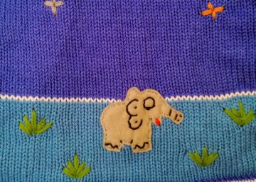 Azuurblauwe sweater maat 74